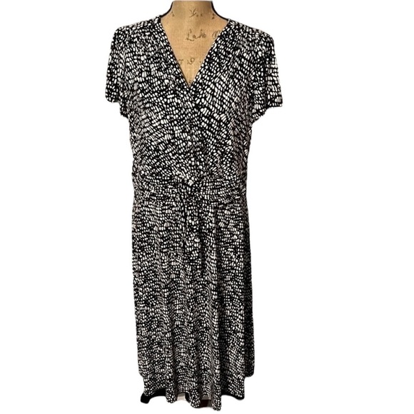 CJ Banks Dresses & Skirts - Black and white polka dot CJ Banks faux wrap dress, lined with front tie. NWT.